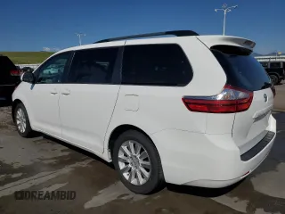 2015 Toyota Sienna LE with VIN 5TDJK3DC2FS126466, listed as a Copart auction lot 61165105 with 56,634 mi miles and Salvage title. Bid and sale history available at DreamBid. Image 2.