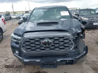 2022 Toyota Tacoma SR5 with VIN 3TMAZ5CN6NM186713, listed as a IAAI auction lot 42607719 with 60,704 mi miles and . Bid and sale history available at DreamBid. Image 12.