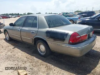 2002 Mercury Grand Marquis LS Premium z VIN 2MEFM75W22X617584, wystawiony jako IAAI lot #42444579 z przebiegiem 199 914 mil mil oraz . Historia ofert i sprzedaży dostępna na DreamBid. Obrazek 3.