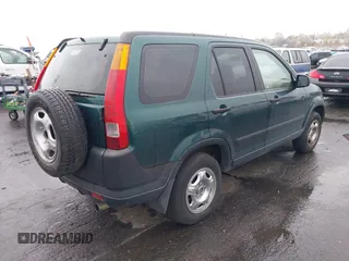 2004 Honda CR-V LX with VIN JHLRD78404C028934, listed as a IAAI auction lot 42023397 with 216,304 mi miles and . Bid and sale history available at carsss.com. Image 4.