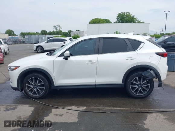 2018 Mazda CX-5 Touring with VIN JM3KFBCMXJ0366008, listed as a IAAI auction lot 42079989 with 153,868 mi miles and . Bid and sale history available at DreamBid. Image 14.