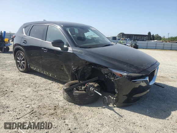 2018 Mazda CX-5 Grand Touring z VIN JM3KFBDM0J0399985, wystawiony jako Copart lot #54097665 z przebiegiem 45 344 mil mil oraz Szkoda całkowita • Salvage title. Historia ofert i sprzedaży dostępna na DreamBid. Obrazek 4.