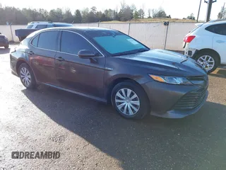 2019 Toyota Camry Hybrid LE z VIN 4T1B31HK4KU516123, wystawiony jako IAAI lot #41733410 z przebiegiem 98 273 mil mil oraz . Historia ofert i sprzedaży dostępna na DreamBid. Obrazek 1.