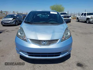 2009 Honda Fit z VIN JHMGE88259S037601, wystawiony jako IAAI lot #42428704 z przebiegiem 55 823 mil mil oraz . Historia ofert i sprzedaży dostępna na DreamBid. Obrazek 13.