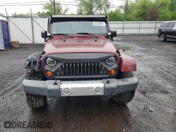 2008 Jeep Wrangler Sahara z VIN 1J4FA54198L505014, wystawiony jako Copart lot #55328045 z przebiegiem 128 049 mil mil oraz Szkoda całkowita • Salvage title. Historia ofert i sprzedaży dostępna na DreamBid. Obrazek 5.