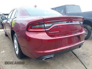 2023 Dodge Charger SXT with VIN 2C3CDXBG9PH659726, listed as a IAAI auction lot 42103636 with 14,321 mi miles and . Bid and sale history available at DreamBid. Image 3.