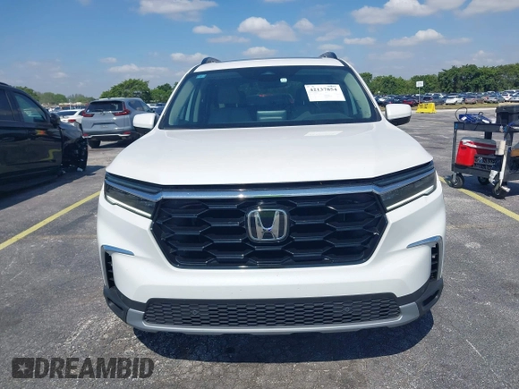 2024 Honda Pilot Touring z VIN 5FNYG2H72RB016937, wystawiony jako IAAI lot #42137854 z przebiegiem 18 028 mil mil oraz . Historia ofert i sprzedaży dostępna na DreamBid. Obrazek 12.