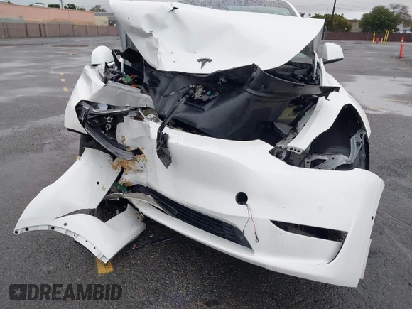 2022 Tesla Model Y Performance with VIN 7SAYGDEFXNF384268, listed as a IAAI auction lot 41558359 with 33,870 mi miles and . Bid and sale history available at DreamBid. Image 6.