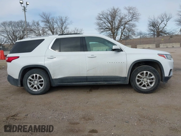 2018 Chevrolet Traverse LT Cloth z VIN 1GNEVGKW8JJ167095, wystawiony jako IAAI lot #41479356 z przebiegiem 98 615 mil mil oraz . Historia ofert i sprzedaży dostępna na DreamBid. Obrazek 14.