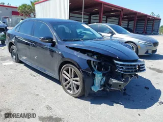 2018 Volkswagen Passat 2.0T S with VIN 1VWAA7A33JC009677, listed as a IAAI auction lot 41796723 with 63,151 mi miles. Bid and sale history available at carsss.com. Image 1.