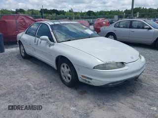 1999 Oldsmobile Aurora z VIN 1G3GR62CXX4100897, wystawiony jako IAAI lot #42277912 z przebiegiem 179 680 mil mil oraz . Historia ofert i sprzedaży dostępna na DreamBid. Obrazek 1.