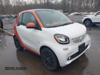 2016 Smart fortwo Passion z VIN WMEFJ5DA6GK075681, wystawiony jako IAAI lot #41677815 z przebiegiem 48 102 mil mil oraz . Historia ofert i sprzedaży dostępna na DreamBid. Obrazek 1.