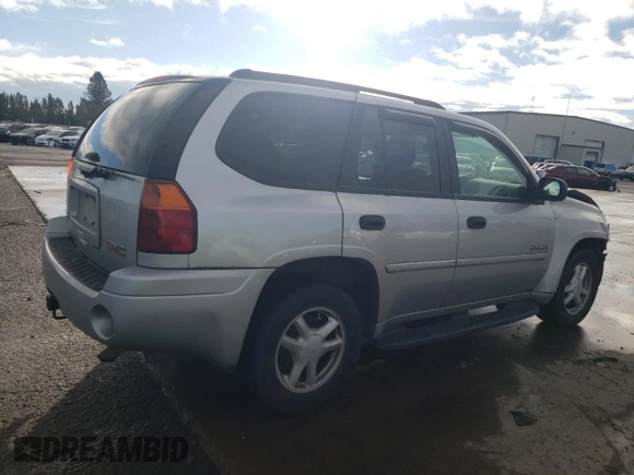 2006 GMC Envoy SLE with VIN 1GKDT13S262327772, listed as a Copart auction lot 85270134 with 242,390 mi miles and Salvage Title. Bid and sale history available at carsss.com. Image 3.