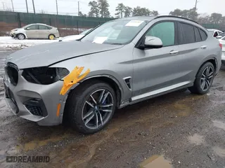 2021 BMW X4 M with VIN 5YMUJ0C01M9F26207, listed as a IAAI auction lot 41502307 with 31,995 mi miles. Bid and sale history available at carsss.com. Image 2.