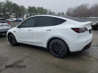 2023 Tesla Model Y Long Range z VIN 7SAYGDEE7PA102174, wystawiony jako Copart lot #49904435 z przebiegiem 144 702 mil mil oraz Szkoda całkowita • Salvage title. Historia ofert i sprzedaży dostępna na DreamBid. Obrazek 2.