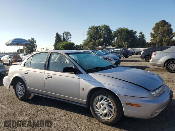 1999 Saturn SL with VIN 1G8ZK5274XZ367394, listed as a Copart auction lot 63863795 with 73,197 mi miles and Salvage title. Bid and sale history available at DreamBid. Image 4.
