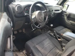 2012 Jeep Wrangler Sport with VIN 1C4AJWAG6CL256792, listed as a Copart auction lot 62634515 with 137,507 mi miles and Salvage title. Bid and sale history available at DreamBid. Image 8.