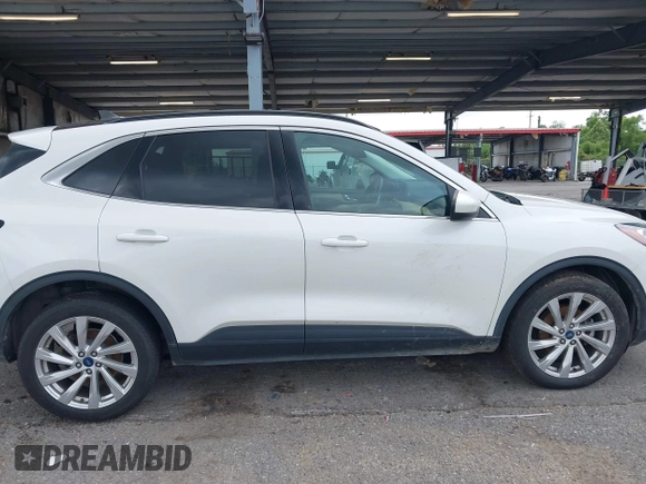 2021 Ford Escape Titanium with VIN 1FMCU9J93MUA36648, listed as a IAAI auction lot 42055229 with 122,864 mi miles and . Bid and sale history available at carsss.com. Image 13.