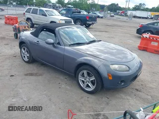 2006 Mazda MX-5 Miata Touring z VIN JM1NC25F560121914, wystawiony jako IAAI lot #42215799 z przebiegiem 154 154 mil mil oraz . Historia ofert i sprzedaży dostępna na DreamBid. Obrazek 1.