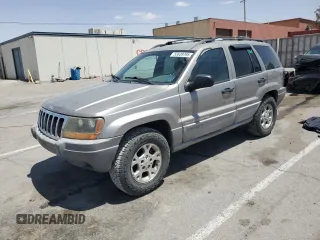 1999 Jeep Grand Cherokee Laredo z VIN 1J4GW58S1XC775877, wystawiony jako Copart lot #55639795 z przebiegiem 197 611 mil mil oraz Szkoda całkowita • Salvage title. Historia ofert i sprzedaży dostępna na DreamBid. Obrazek 1.