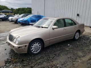 2001 Mercedes-Benz E-Class with VIN WDBJF65J01B389296, listed as a Copart auction lot 71933404 with 124,392 mi miles and Salvage Title. Bid and sale history available at carsss.com. Image 1.