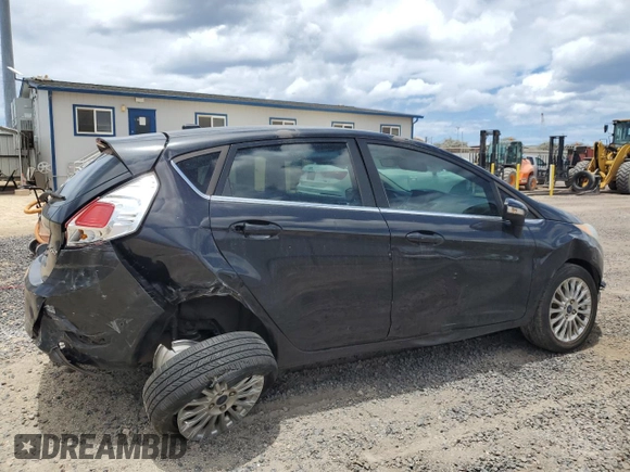 2014 Ford Fiesta Titanium z VIN 3FADP4FJXEM228098, wystawiony jako Copart lot #55173975 z przebiegiem 109 311 mil mil oraz Szkoda całkowita • Salvage title. Historia ofert i sprzedaży dostępna na DreamBid. Obrazek 3.