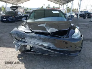 2019 Tesla Model 3 Mid Range with VIN 5YJ3E1EA1KF410297, listed as a IAAI auction lot 41841991 with 176,254 mi miles. Bid and sale history available at carsss.com. Image 6.
