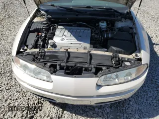 2003 Oldsmobile Aurora z VIN 1G3GS64CX34163493, wystawiony jako Copart lot #75863314 z przebiegiem 211 607 mil mil oraz Szkody całkowita. Historia ofert i sprzedaży dostępna na DreamBid. Obrazek 11.