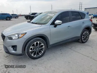 2016 Mazda CX-5 Grand Touring z VIN JM3KE2DY5G0886436, wystawiony jako Copart lot #58147045 z przebiegiem 84 147 mil mil oraz Szkoda całkowita • Salvage title. Historia ofert i sprzedaży dostępna na DreamBid. Obrazek 1.
