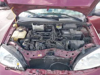 2007 Ford Focus S z VIN 1FAHP34NX7W114297, wystawiony jako IAAI lot #41774573 z przebiegiem 111 079 mil mil oraz . Historia ofert i sprzedaży dostępna na DreamBid. Obrazek 10.