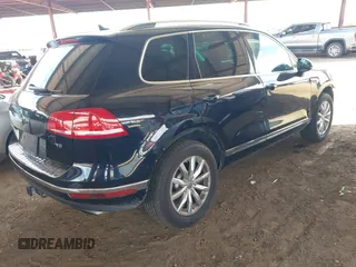 2016 Volkswagen Touareg Sport with VIN WVGEF9BP0GD012148, listed as a IAAI auction lot 42195030 with 95,984 mi miles and . Bid and sale history available at DreamBid. Image 4.