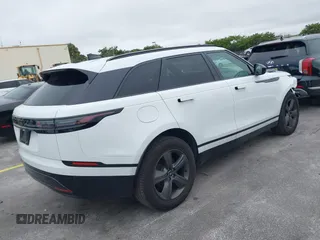 2025 Land Rover Range Rover Velar Dynamic SE с VIN SALYL2EX3SA398659, выставлен на аукционе IAAI как лот 41335449 с пробегом 14 875 миль миль и . История ставок и продаж доступна на DreamBid. Изображение 4.