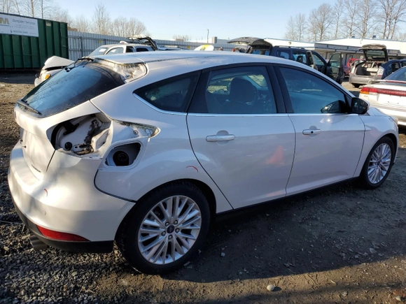 2015 Ford Focus Titanium with VIN 1FADP3N25FL325037, listed as a Copart auction lot 42248985 with 58,831 mi miles and Salvage Title. Bid and sale history available at carsss.com. Image 3.
