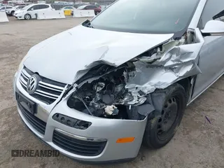 2010 Volkswagen Jetta Sedan S with VIN 3VWJZ7AJ1AM003298, listed as a IAAI auction lot 41583771 with 127,234 mi miles. Bid and sale history available at carsss.com. Image 6.