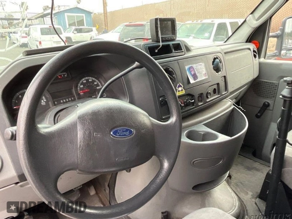 2010 Ford Econoline Cargo Commercial with VIN 1FTNE1EW7ADA90834, listed as a IAAI auction lot 41950672 with 215,864 mi miles. Bid and sale history available at carsss.com. Image 1.