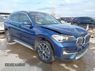 2021 BMW X1 xDrive28i with VIN WBXJG9C07M5T98125, listed as a IAAI auction lot 41878718 with 34,331 mi miles. Bid and sale history available at carsss.com. Image 1.