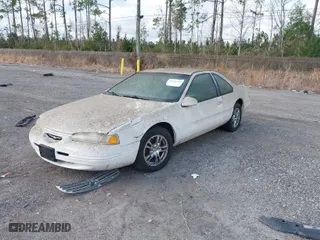 1996 Ford Thunderbird LX with VIN 1FALP62W4TH154400, listed as a IAAI auction lot 41394723 with 65,860 mi miles. Bid and sale history available at carsss.com. Image 2.