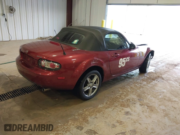2007 Mazda MX-5 Miata Sport z VIN JM1NC25F970132299, wystawiony jako IAAI lot #41622791 z przebiegiem 72 392 mil mil oraz . Historia ofert i sprzedaży dostępna na DreamBid. Obrazek 4.