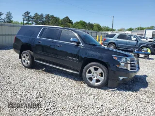 2018 Chevrolet Suburban Premier with VIN 1GNSCJKC1JR199271, listed as a Copart auction lot 52395935 with 216,083 mi miles and Salvage Title. Bid and sale history available at DreamBid. Image 4.
