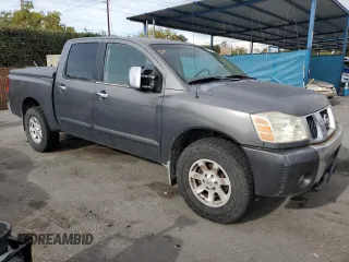 2005 Nissan Titan SE with VIN 1N6AA07B65N566082, listed as a Copart auction lot 80879174 with 215,297 mi miles and Clean Title. Bid and sale history available at carsss.com. Image 4.