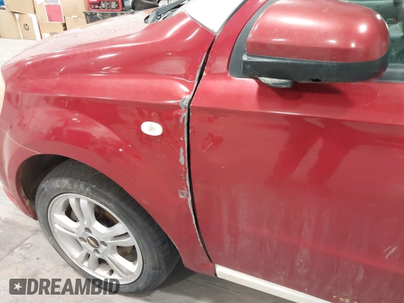 2011 Chevrolet Aveo 1LT z VIN KL1TD5DE4BB118796, wystawiony jako IAAI lot #41932392 z przebiegiem 128 034 mil mil oraz . Historia ofert i sprzedaży dostępna na DreamBid. Obrazek 13.