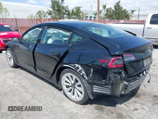 2022 Tesla Model 3 with VIN 5YJ3E1EA4NF316127, listed as a IAAI auction lot 41939191 with 30,857 mi miles. Bid and sale history available at carsss.com. Image 3.