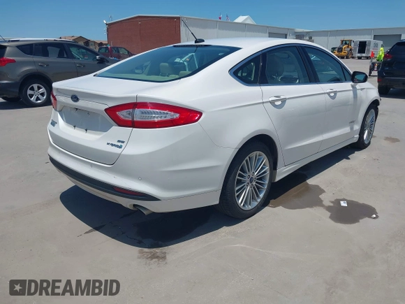 2014 Ford Fusion SE Hybrid with VIN 3FA6P0LUXER233658, listed as a IAAI auction lot 42311588 with 106,282 mi miles and . Bid and sale history available at DreamBid. Image 4.