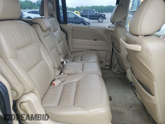 2010 Honda Odyssey Touring z VIN 5FNRL3H97AB082525, wystawiony jako Copart lot #56410845 z przebiegiem 94 819 mil mil oraz Szkoda całkowita • Salvage title. Historia ofert i sprzedaży dostępna na DreamBid. Obrazek 10.