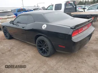 2013 Dodge Challenger SXT z VIN 2C3CDYAGXDH718768, wystawiony jako IAAI lot #41339735 z przebiegiem 187 052 mil mil oraz . Historia ofert i sprzedaży dostępna na DreamBid. Obrazek 3.