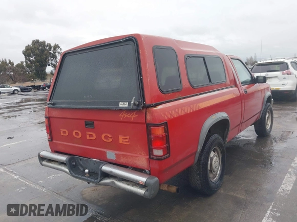 1991 Dodge Dakota z VIN 1B7GG66Y7MS210454, wystawiony jako IAAI lot #41778373 z przebiegiem 151 112 mil mil oraz . Historia ofert i sprzedaży dostępna na DreamBid. Obrazek 4.