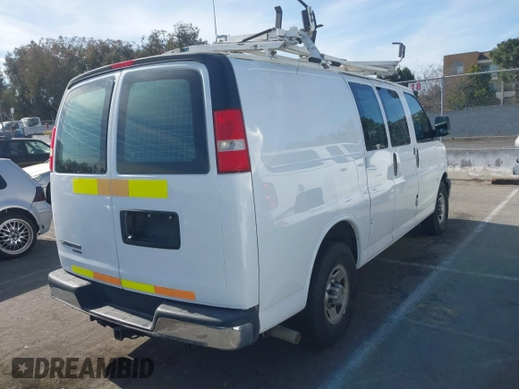 2014 Chevrolet Express Cargo Van with VIN 1GCWGFCB2E1122236, listed as a IAAI auction lot 41381131 with 70,696 mi miles. Bid and sale history available at carsss.com. Image 4.