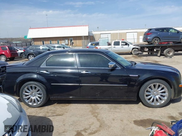 2009 Chrysler 300 C z VIN 2C3LA63T39H612810, wystawiony jako IAAI lot #41827898 z przebiegiem 76 558 mil mil oraz . Historia ofert i sprzedaży dostępna na DreamBid. Obrazek 14.