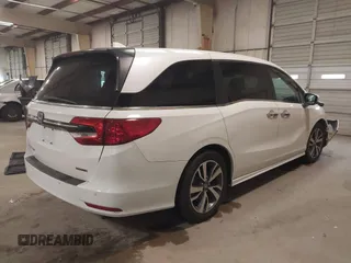 2021 Honda Odyssey Touring with VIN 5FNRL6H80MB026908, listed as a IAAI auction lot 41564765 with 116,453 mi miles. Bid and sale history available at carsss.com. Image 4.
