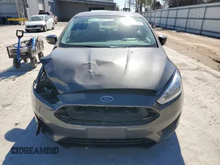 2015 Ford Focus SE с VIN 1FADP3F22FL299799, выставлен на аукционе Copart как лот 42420665 с пробегом 141 349 миль миль и Списание • Salvage title. История ставок и продаж доступна на DreamBid. Изображение 5.